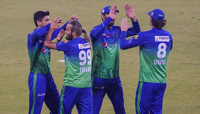 Multan Sultans players celebrate after dismissing a Islamabad United batter. — PSL