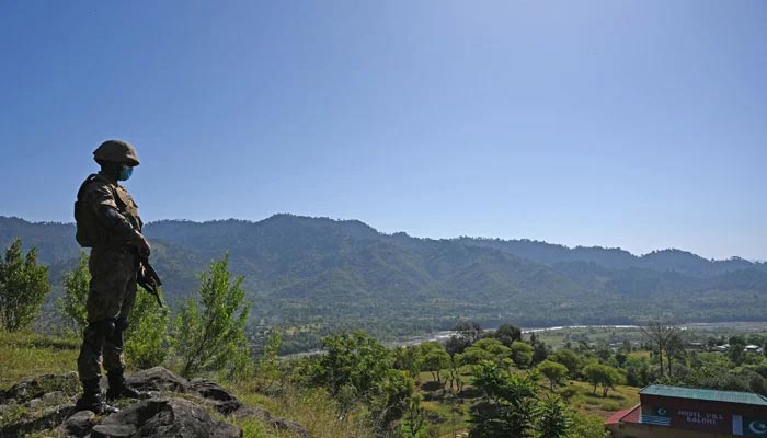 A soldier standing guard in a mountainous area — AFP/File