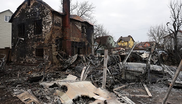 The wreckage of an unidentified aircraft that crashed into a house in a residential area is seen, after Russia launched a massive military operation against Ukraine, in Kyiv, Ukraine February 25, 2022. — Reuters
