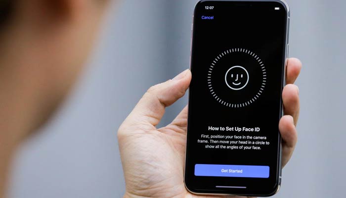 An attendee uses the Face ID function on the new iPhone X during a presentation for the media in Beijing, China October 31, 2017. — Reuters/File