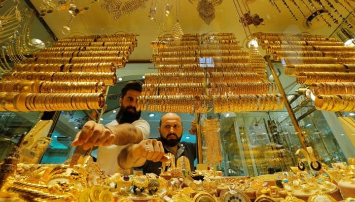 A picture showing two gold dealers selling jewellery at their store. — Reuters/File