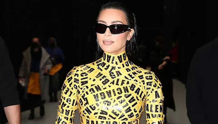 Kim Kardashian wraps herself in shipping tape catsuit at fashion show in Paris