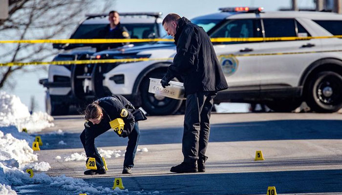 Police investigate a shooting outside of East High School in in Des Moines, Iowa, on Monday, March 7, 2022. Photo—AP