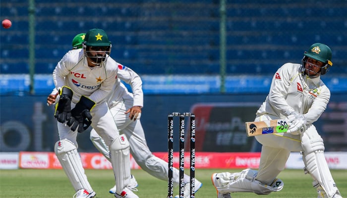 Australias Usman Khawaja plays a shot during the second day of the second Test match between Pakistan and Australia at the National Cricket Stadium in Karachi on March 13, 2022. — AFP