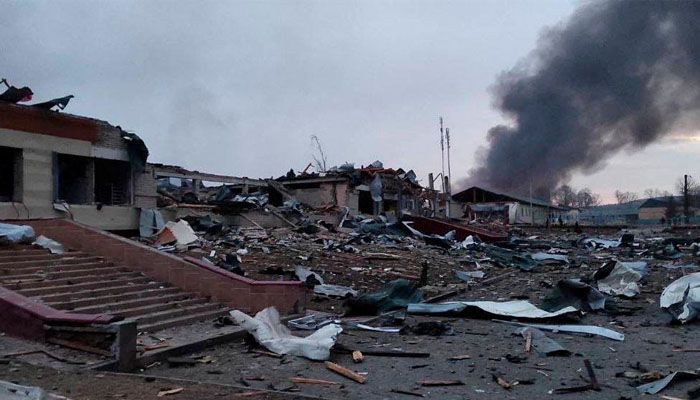 Smoke rises amid damaged buildings following an attack on the Yavoriv military base. Photo— Back And Alive / via REUTERS