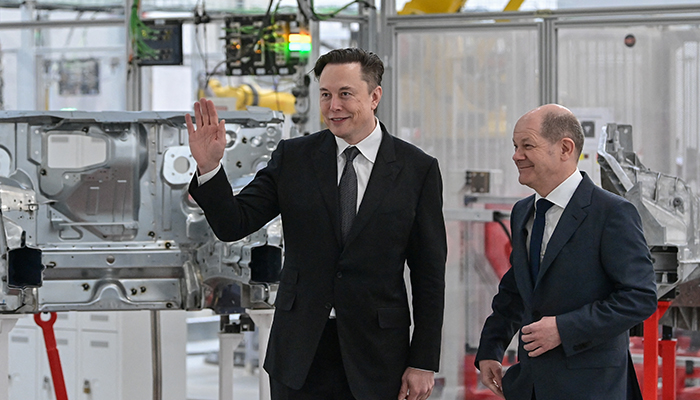 German Chancellor Olaf Scholz and Elon Musk attend the opening ceremony of the new Tesla Gigafactory for electric cars in Gruenheide, Germany, March 22, 2022. — Reuters