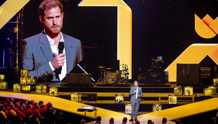 The Duke of Sussex appears on a giant screen as he speaks during the opening ceremony of The Invictus Games in The Hague on April 16, 2022- AFP