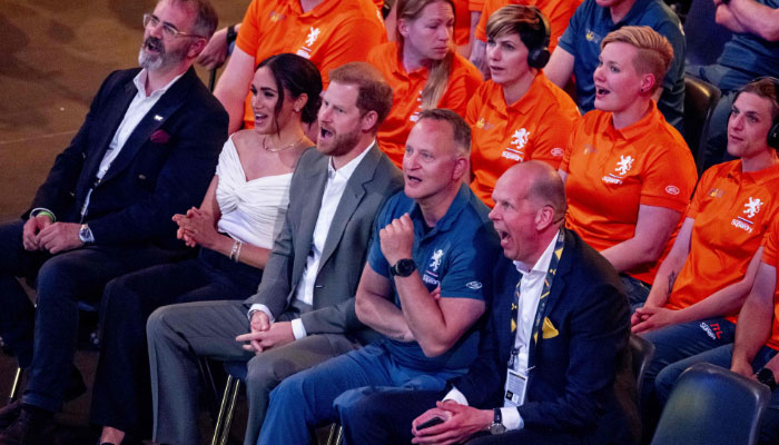 Prince Harry (C) and Meghan Markle attend the opening ceremony of the Invictus Games in The Hague on April 16, 2022- AFP