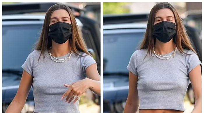 Hailey Bieber shows off her toned figure in black crop top and