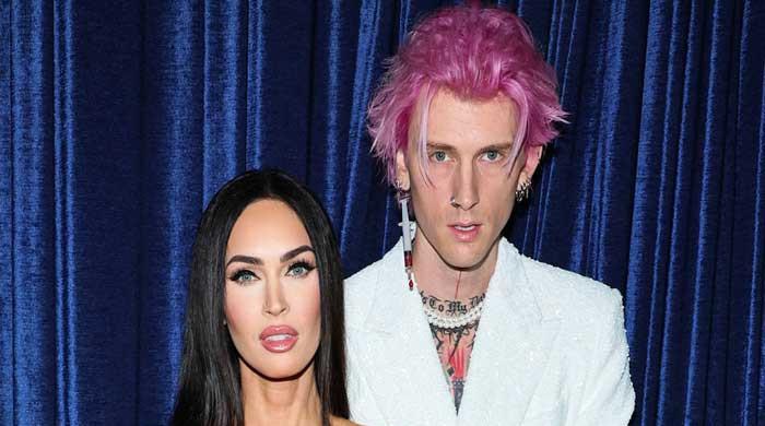 Machine Gun Kelly fashions blood filled syringe earring with fiancée ...