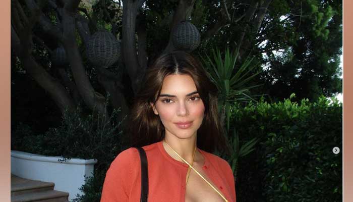 Kendall Jenner puts her enviable physique on display in tiny yellow top