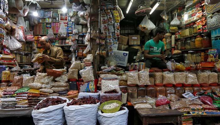 Vendors wait for customers at their respective shops at a retail market in Kolkata, India, December 12, 2018. — Reuters/File