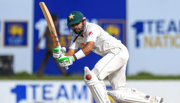 Pakistan skipper Babar Azam hits a shot during the second day of the second cricket Test match between Sri Lanka and Pakistan at the Galle International Cricket Stadium in Galle on July 25, 2022. — AFP