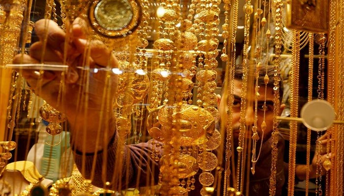 A representational image of gold dealer setting jewellery in his shop. — Reuters/File