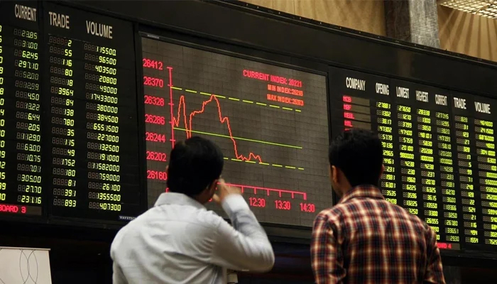 Investors looking at the digital stock board in the Pakistan Stock Exchange. — AFP/File