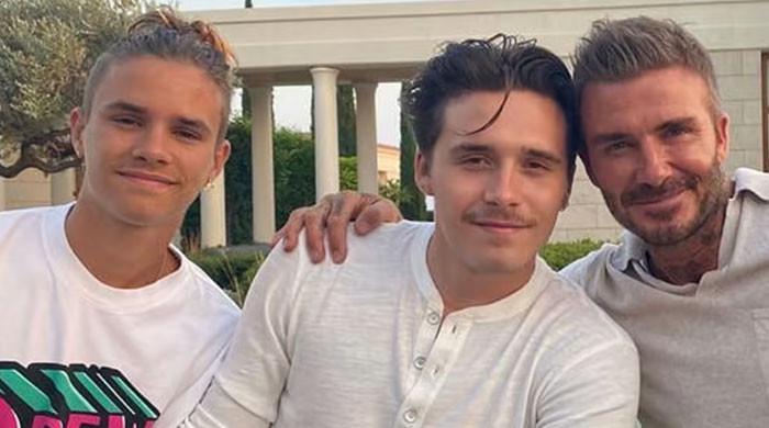 Brooklyn Beckham 'crying' on brother Romeo shoulder as Victoria and ...