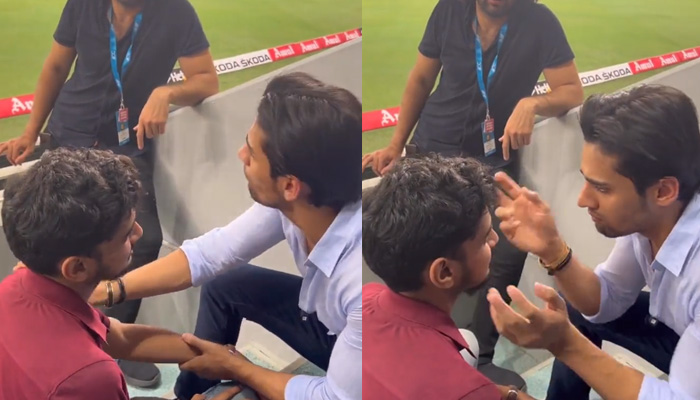 British-Pakistani social media sensation Momin Saqib (in the white shirt) acts like Shahrukh Khan alongside an Indian fan in Dubai. — Twitter