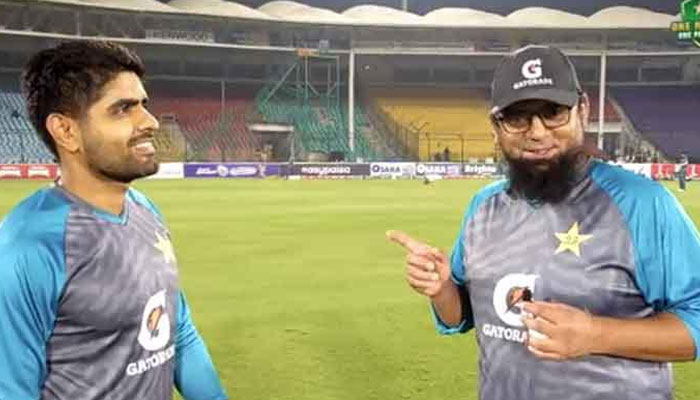 Saqlain Mushtaq and Babar Azam pictured during the match. — PCB Twitter video