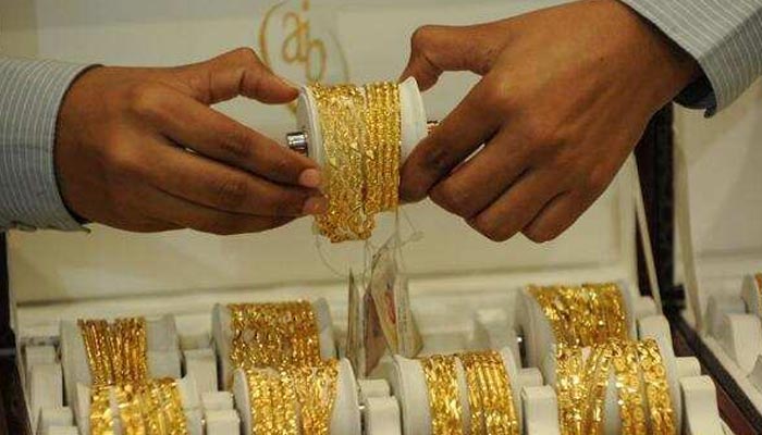 A representation image of gold bangles. — AFP/File