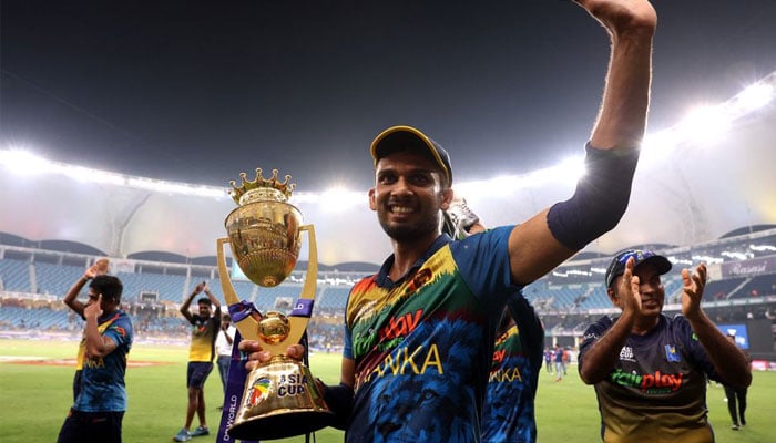 Sri Lankas Dasun Shanaka celebrates with the trophy after winning the Asia Cup on September 11, 2022. — Reuters