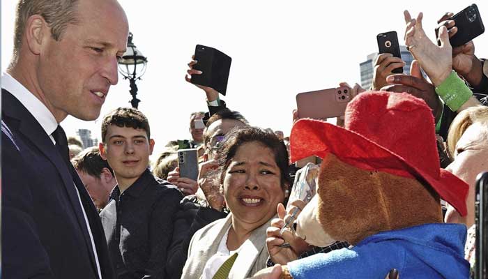 Prince William and mourners exchange heartfelt words