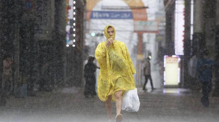 Typhoon Batters Japan With Record Rain, Killing One