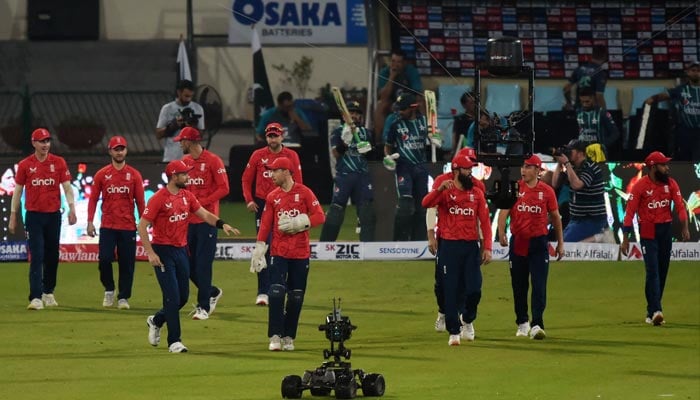 England cricketers enter the field before the start of the fifth T20 international cricket match between Pakistan and England at the Gaddafi Cricket Stadium in Lahore on September 28, 2022. — AFP