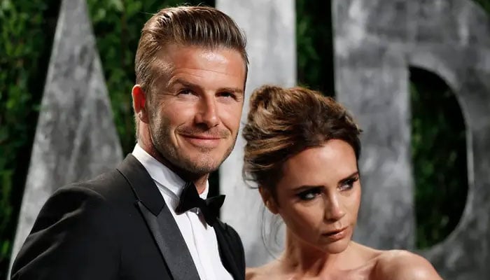 Victoria Beckham appears with husband David - boldly sporting a