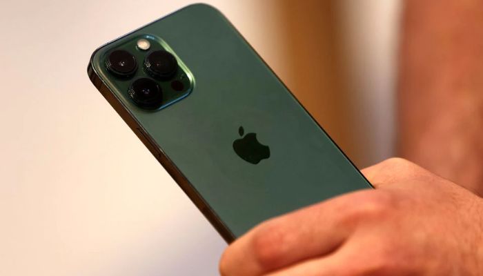 A customers holds the new green colour Apple iPhone 13 pro shortly after it went on sale inside the Apple Store on 5th Avenue in Manhattan in New York City, New York, U.S., March 18, 2022.— Reuters