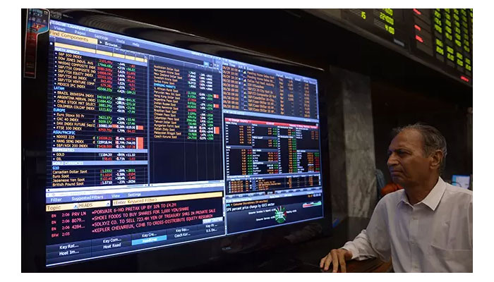 A stockbroker reads a trading screen at Pakistan Stock Exchange (PSX).— Reuters/File