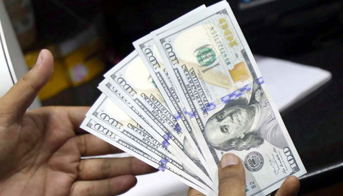 Currency dealers fear the alarming increase will fan panic in the market for dollars, in Karachi on Wednesday, May 18, 2022. — Online/File