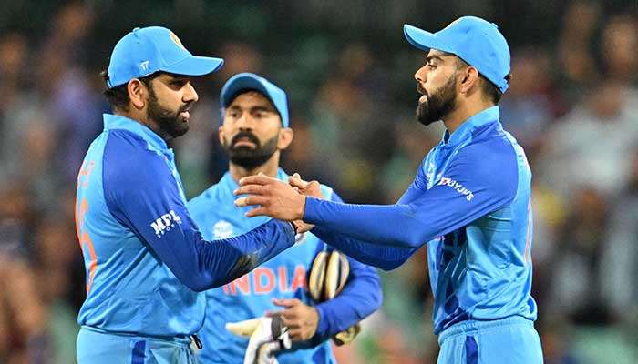 Indias Virat Kohli (R) and Indias captain Rohit Sharma shake hands after their victory during the ICC mens Twenty20 World Cup 2022 cricket match between India and Netherlands at the Sydney Cricket Ground in Sydney on October 27, 2022. — AFP