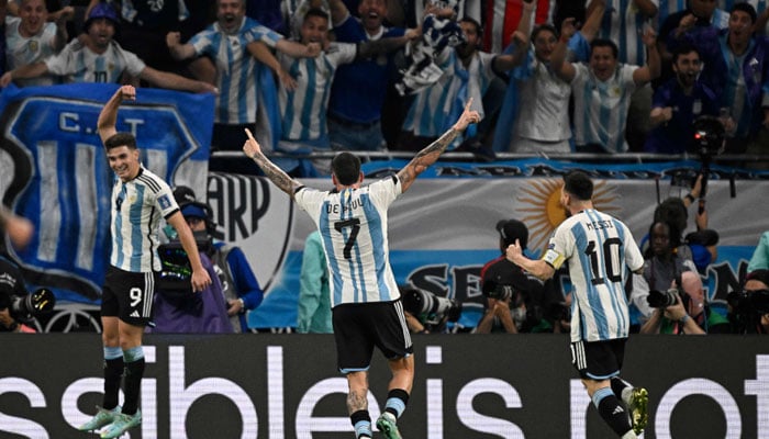 Argentinas forward Julian Alvarez (L) celebrates scoring his teams second goal during the Qatar 2022 World Cup round of 16 football match between Argentina and Australia at the Ahmad Bin Ali Stadium in Al-Rayyan, west of Doha on December 3, 2022. AFP