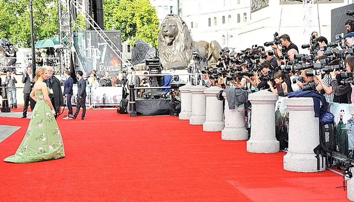 However, the image was actually taken at Harry Potter and the Deathly Hallows: Part Two where photographers were trying to take an image of the film cast