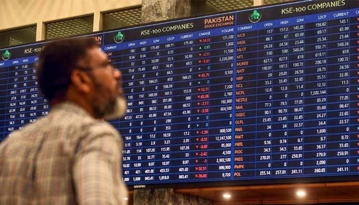 A stockbroker reads values on a trading screen at Pakistan Stock Exchange.— Reuters/File