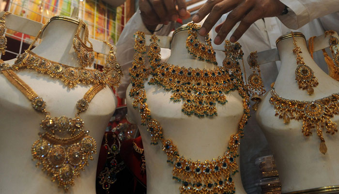 Gold sets are displayed in a jewellery store in this undated image. — AFP/File