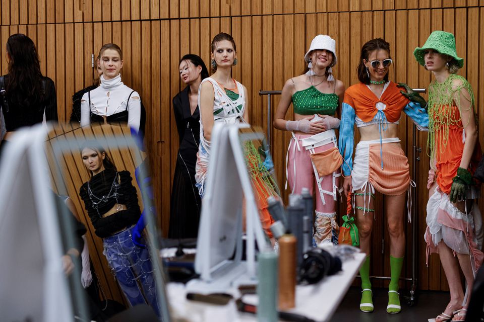 Models wait at the backstage before the Fashion X AI : Call For Young Talents 2022 fashion show in Hong Kong, China, December 19, 2022. — Reuters