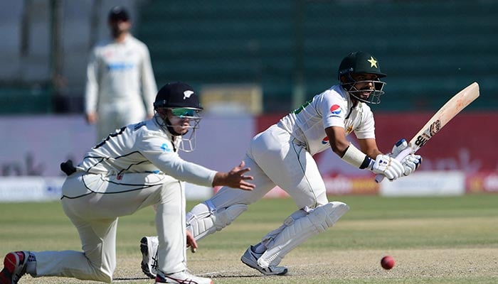 Pakistan´s Saud Shakeel (R) plays a shot during the third day of the second cricket Test match between Pakistan and New Zealand at the National Stadium in Karachi on January 4, 2023. — AFP