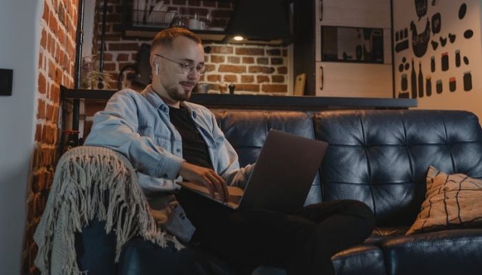 Man on a Couch Using a Laptop.— Pexels