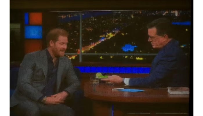 Prince Harry drinks during interview with Stephen Colbert