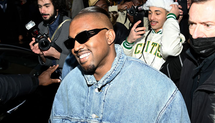 Kanye West enjoys meal with mystery woman amid media backlash