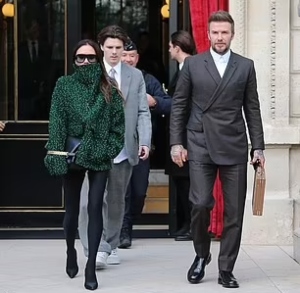 Victoria Beckham looks chic in Paris while David is mobbed by fans at his  pop-up store in the city