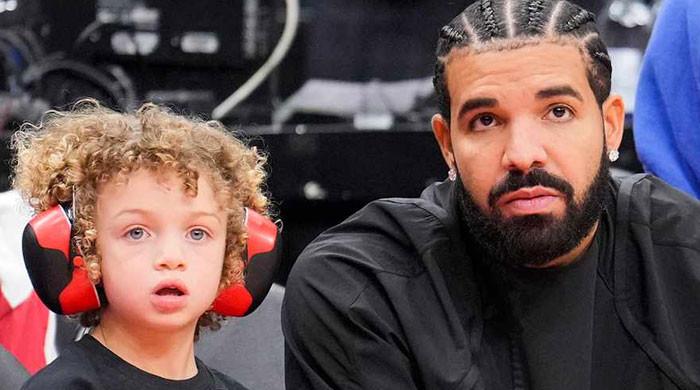 Drake and his son Adonis pose in matching outfits at mum’s birthday party