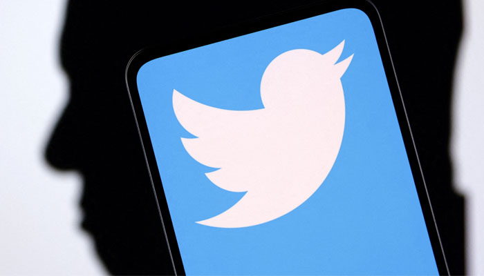 Twitter logo and Elon Musk silhouette are seen in this illustration taken, December 19, 2022. — Reuters/File