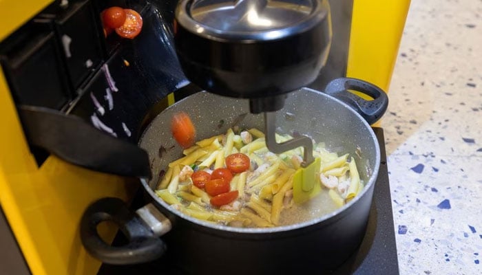 Robot chef prepares the meal at the restaurant Bots & Pots in Zagreb, Croatia, February 9, 2023.— Reuters
