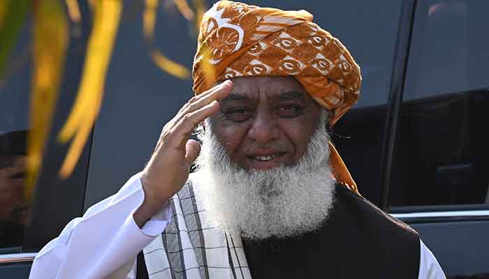 Jamiat Ulema Islam (JUI)s chief Fazlur Rehman gestures as he arrive to attent a press conference in Islamabad on March 30, 2022. — AFP