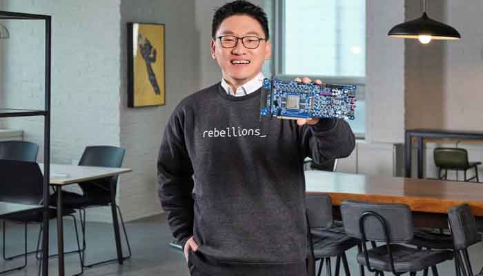 AI chip startup Rebellions co-founder and chief executive Park Sunghyun shows off an printed circuit board including the latest ATOM chip at the company headquarters in Seongnam, South Korea February 2023. — Reuters