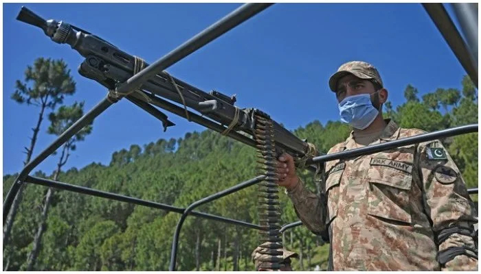 A soldier patrols near the Line of Control at Salohi village in Poonch district of Azad Jammu and Kashmir on April 26, 2021. — AFP