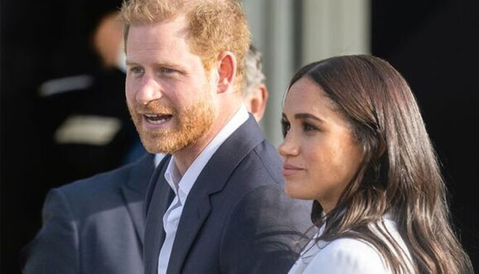 Meghan takes a stroll with a smug grin after getting what she wanted