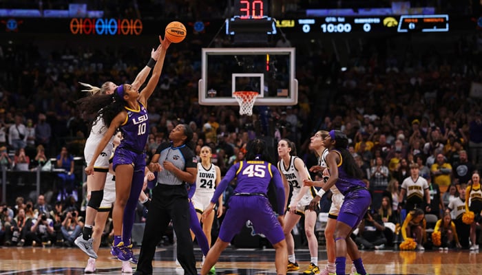 Angel Reese of the LSU Lady Tigers and Monika Czinano of the Iowa Hawkeyes jump for the ball to start the game during the 2023 NCAA Womens Basketball Tournament championship game at American Airlines Center on April 02, 2023, in Dallas, Texas. — AFP